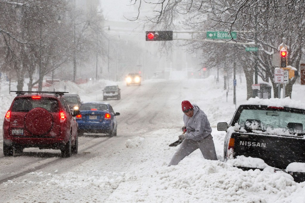 image: Shoveling out cars was just one of the battles of the storm on Dec. 20, 2012 in Madison, Wis.
