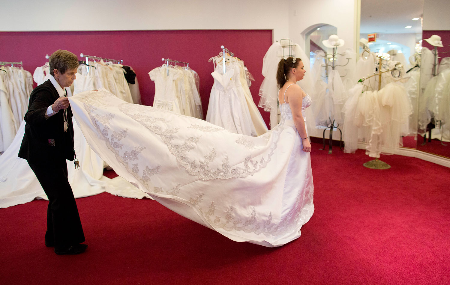 image: Bethany Wood, of Jackson, Mich., tries on a wedding gown before being married in Las Vegas.