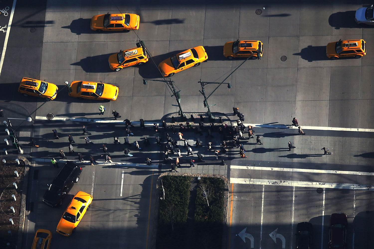 Pedestrians cross the street in lower Manhattan as seen from One World Observatory from the 100th floor of One World Trade Center at the Ground Zero site on April 2, 2013 in New York City.