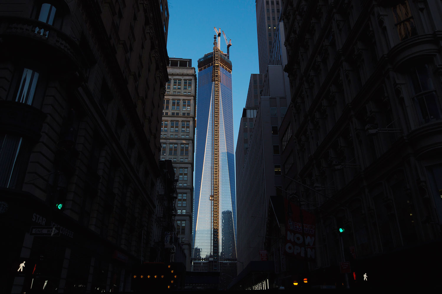 The rising sun hits the side of One World Trade Center as it stands among other buildings in New York, April 2, 2013.