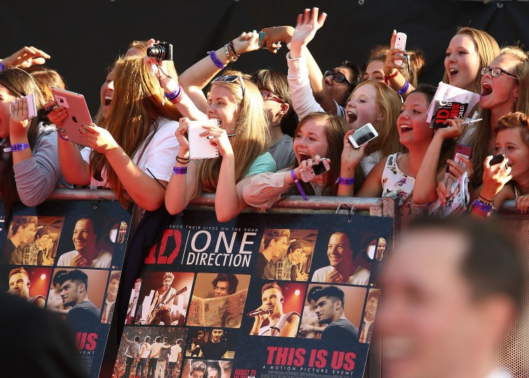 One Direction fans attend the World Premiere of 'One Direction: This Is Us' at Empire Leicester Square on Aug. 20, 2013 in London.