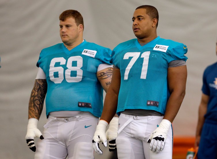 From left: Miami Dolphins guard Richie Incognito and tackle Jonathan Martin during an NFL football practice in Davie, Fla., on July 24, 2013.