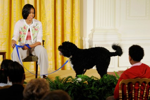Bo and Michelle Obama attend an event to welcome children of White House employees to the White House in Washington