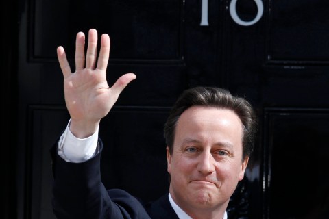 Britain's Prime Minister Cameron waves outside 10 Downing Street in London