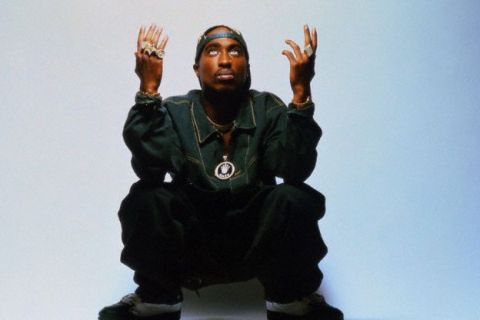 Rapper Tupac Shakur Throwing Hands in Air