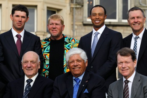 Past winners of the British Open golf championship pose in front of the clubhouse on the Old Course in St. Andrews