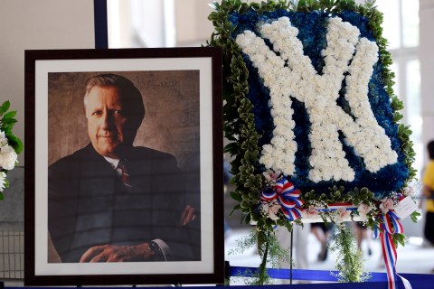 A picture honoring the late owner of the New York Yankees George Steinbrenner stands in the lobby of Yankee Stadium before their game against Tampa Bay Rays in New York