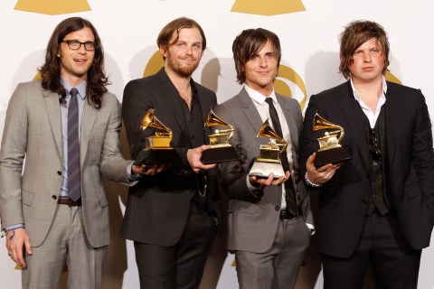 Kings of Leon hold their awards backstage at the 52nd annual Grammy Awards in Los Angeles