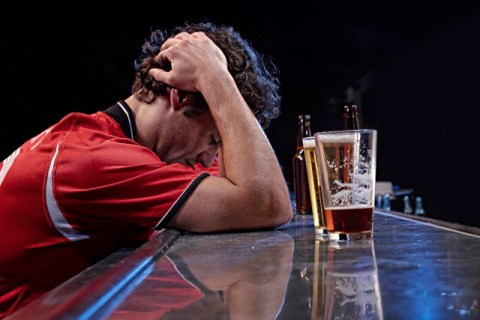 Unhappy sports fan in a bar