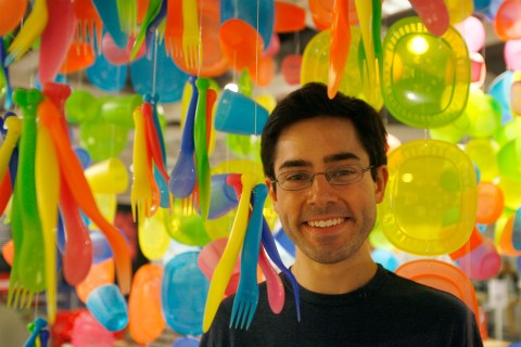 Mark Malkoff poses for a portrait among plastic cutlery hanging from the ceiling inside an IKEA store in Paramus, New Jersey