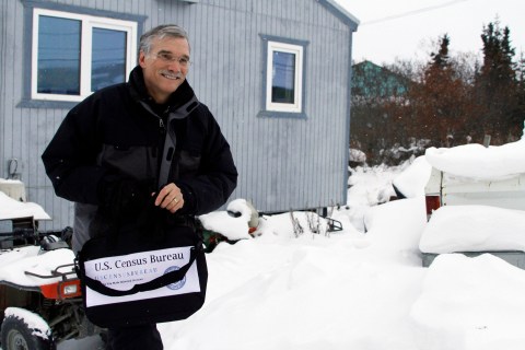 U.S. Census Bureau Director Groves walks out of the home of Jackson in Noorvik