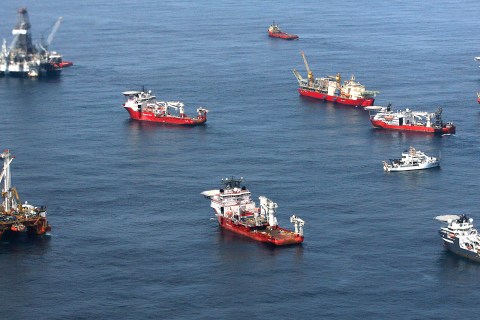 Drill ships and response vessels work in the Gulf of Mexico off the Louisiana coast line while attempting to drill relief wells  at the Deepwater Horizon Oil Spill wellhead