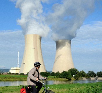 Cyclists in front of nuclear power plant