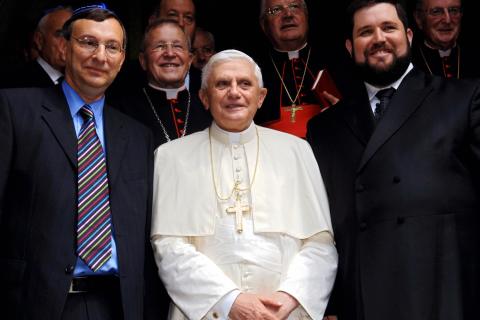 Pope Benedict XVI (C) poses surrounded b