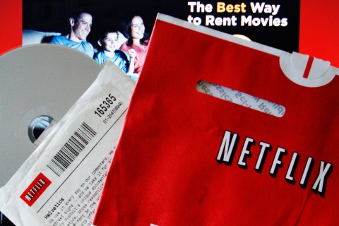 File photo of DVD rental and screen shot of Netflix website
