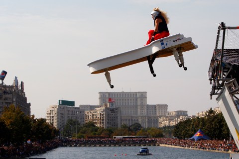 A participant rides in a self-made flying craft during the annual Red Bull Flugtag (Flight Day) event in Bucharest
