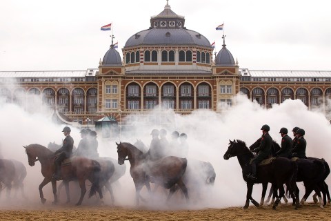 Members of the Dutch Royal guard of honour rehearse ahead of the Dutch 2011 budget presentation on the beach at Scheveningen