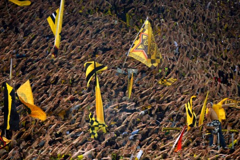 Borussia Dortmund's supporters cheer their team during the German Bundesliga soccer match against Kaiserslautern in Dortmund