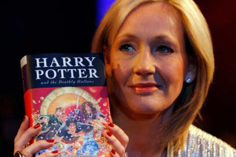 British author J.K. Rowling poses with a copy of her new book "Harry Potter and the Deathly Hallows" at the Natural History Museum in London