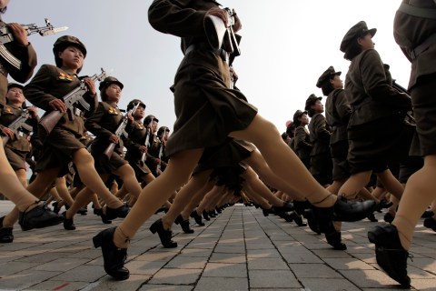 Female North Korean soldiers march during a military parade to commemorate the 65th anniversary of founding of the Workers' Party of Korea in Pyongyang