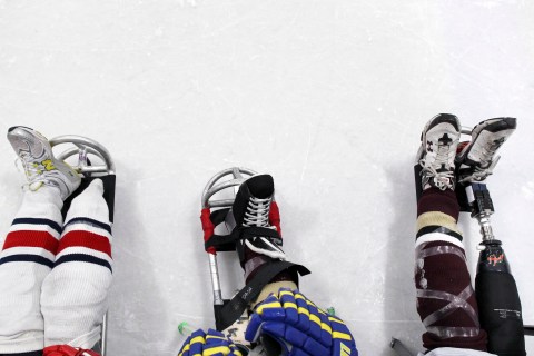 The legs of Team USA sled hockey members are seen at a game during the 6th National Disabled Festival in Laurel