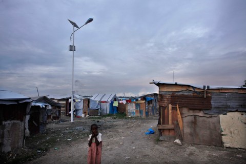 A solar-powered lamp is seen inside a provisional camp for earthquake victims in Port-au-Prince