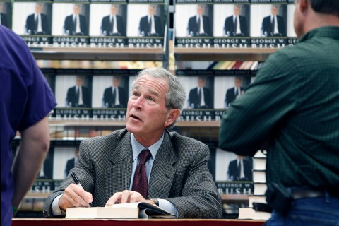 George W. Bush signing copies of Decision Points