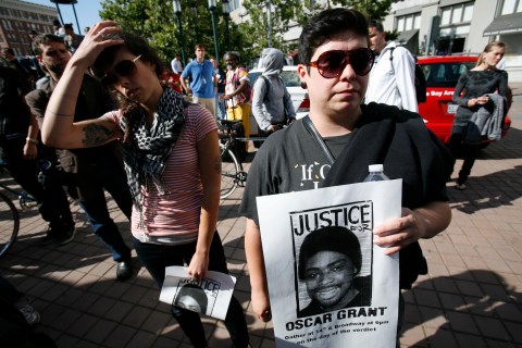 Demonstrators gather in Oakland to protest the verdict on the case of BART officer Johannes Mehserle