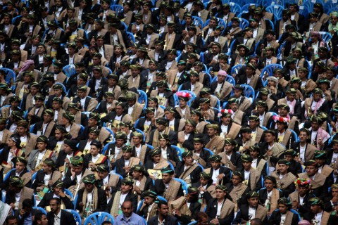 Bridegrooms attend a mass wedding ceremony in Sanaa