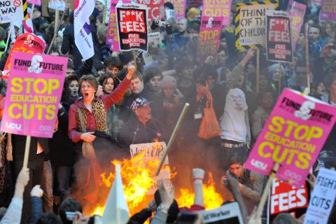 Demonstrators protest outside the Conservative Party headquarters building in central London