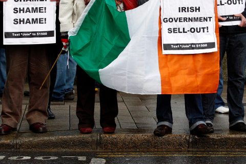 Sinn Fein protestors demonstrate outside Leinster House in Dublin