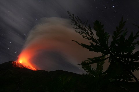 Ecuador's Tungurahua volcano spews molten rocks and large clouds of gas and ash near Banos