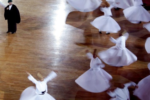 Whirling Dervishes perform during the Mevlana's 737th Reunion Anniversary International Commemoration Ceremonies
