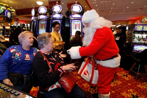 Santa hands out gifts in a casino