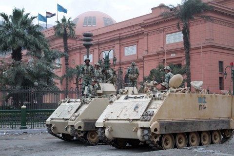 Egyptian soldiers stand guard in front o