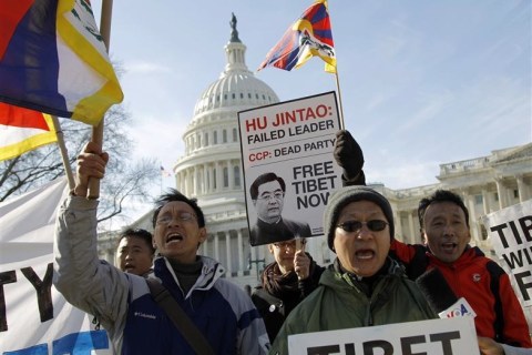 Protesters against the visit by China's President Hu demonstrate outside the U.S. Capitol Building in Washington