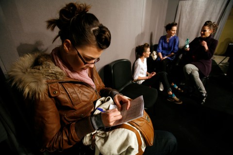 A model is seen backstage playing Sudoku 