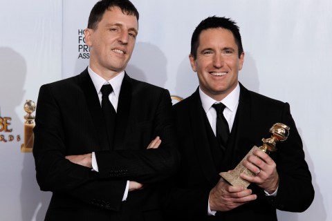 Reznor and Ross pose with their award for best original score-motion picture backstage at the 68th annual Golden Globe Awards in Beverly Hills