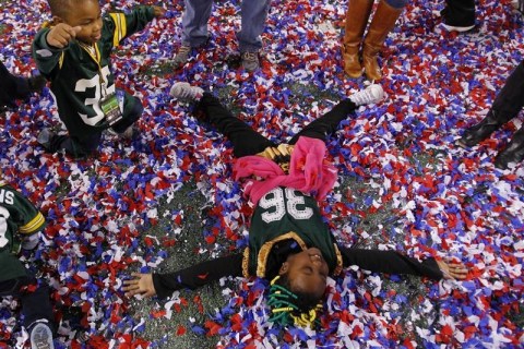 Six year-old Jenajah Collins plays on the field after the Packers and her father, safety Nick Collins, defeated the Steelers to win the NFL's Super Bowl XLV football game in Arlington