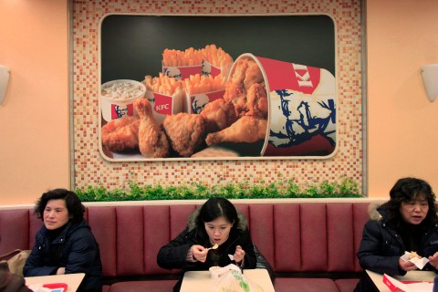 People dine at a Kentucky Fried Chicken outlet in Shanghai