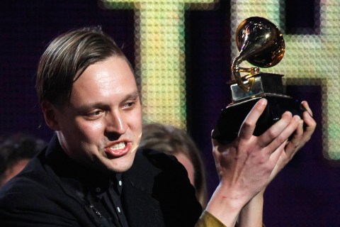 Edwin Butler of Canadian band Arcade Fire holds up the Grammy for Album of the Year for "The Suburbs" at the 53rd annual Grammy Awards in Los Angeles