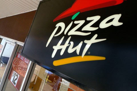 A Pizza Hut logo is pictured outside its restaurant in Vienna