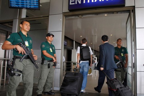 Aviation security force stands guard during a heightened alert outside the Manila International Airport