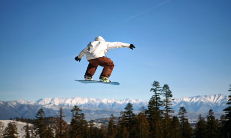 104143378 Snowboarder jumping at Mammoth Mountain Resort