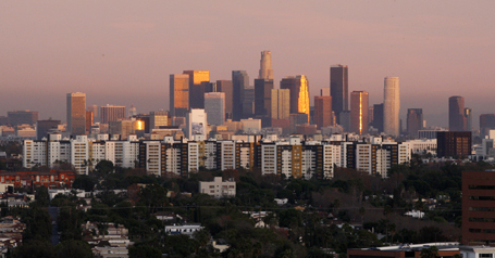 The Los Angeles skyline is shown in the distance as seen from the 15th floor of a hotel in Beverly Hills