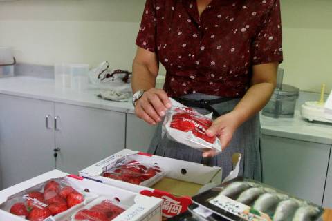 An official from Atoms of Peace, an authority in nuclear research in Thailand, prepares to test food imported from Japan, before the tsunami and earthquake, for radioactivity at their office in Bangkok
