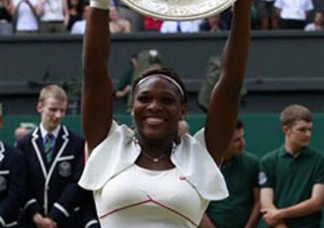 Serena Williams of the U.S. holds the winners trophy after defeating Russia's Vera Zvonareva in the womens' singles final at the 2010 Wimbledon tennis championships in London