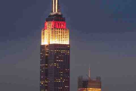 The Empire State Building is lit in red and white to raise awareness for the disaster in Japan, in New York