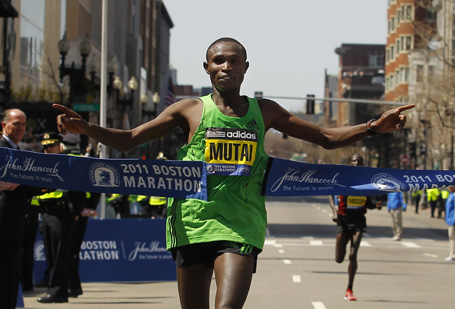Mutai of Kenya crosses the finish line to win the men's division of the 2011 Boston Marathon