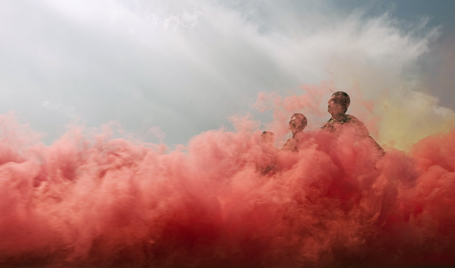 Afghan National Army Non-Commissioned Officer recruits march through coloured smoke during parade to mark graduation ceremony at Turkish-run Camp Ghazi in Kabul